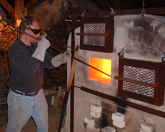 Tony Moore stoking the kiln.